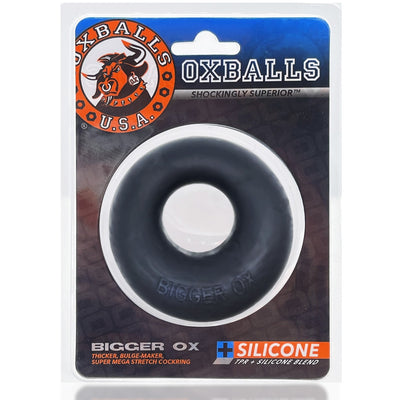Oxballs Bigger Ox thick black silicone TPR blend cockring in branded retail packaging with logo and product details.