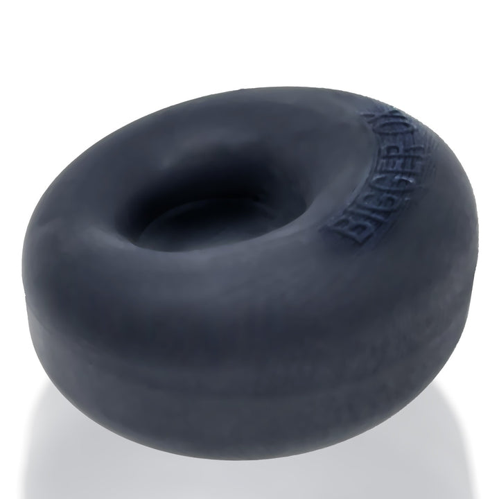 Black thick silicone TPR cockring with a smooth, rounded shape and embossed branding on the side.