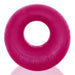 Bright pink thick silicone TPR cockring with embossed Bigger Ox branding, smooth and rounded design.