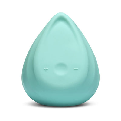 Teal triangular personal massager with plus and minus buttons on smooth silicone surface.