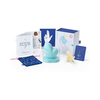 Biird Namii Jouissance Club Edition mint green stimulator with packaging, guidebook, storage pouch, necklace, and art print.