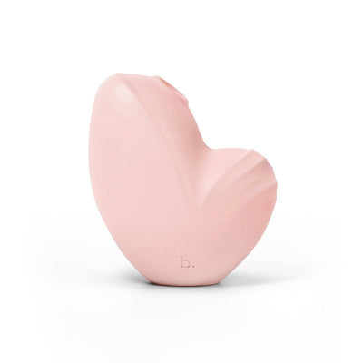 Soft pink Biird Namii clitoral stimulator with ergonomic curved design and subtle textured details.