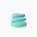 Stacked set of three mint green silicone rings with smooth and textured designs, featuring subtle embossed branding.