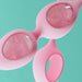 Close-up of Biird Yonii 2-piece set featuring pink silicone handles with natural rose quartz eggs.
