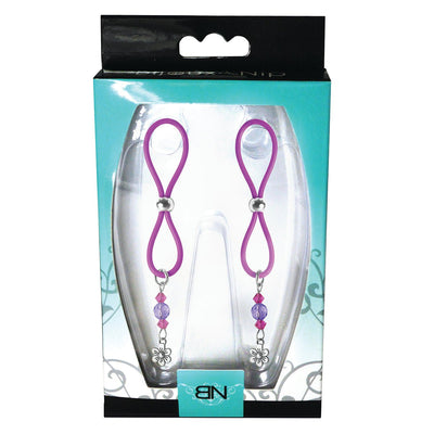 Purple silicone nipple halos with adjustable silver beads and flower charms in retail packaging.