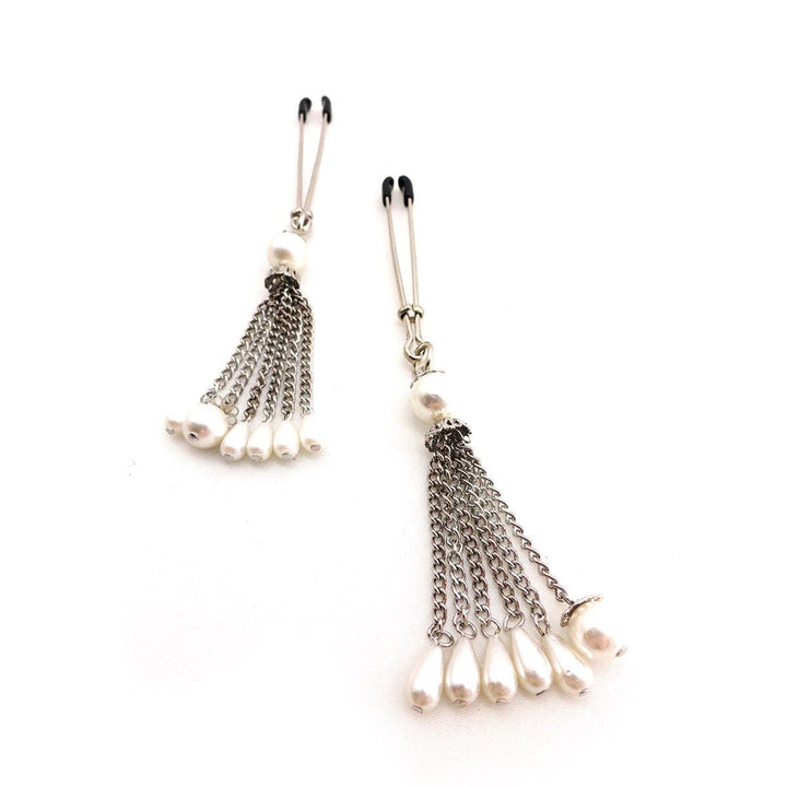 Pair of chrome-plated tweezer clamps with large faux pearls and cascading silver chain tassels with pearl drops.