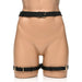 Black adjustable faux leather bondage harness with waist and thigh straps featuring silver buckles on a mannequin.
