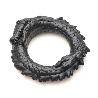 Black silicone cock ring shaped like a coiled caiman with textured scales and a detailed grinning face.