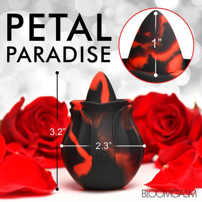 Black and red marbled rose-shaped silicone toy with dimensions and red rose petals around it on a white background.