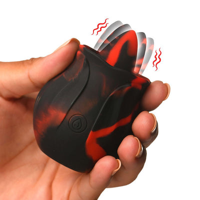 Hand holding a black and red silicone rose-shaped rimming toy with a vibrating tongue feature.