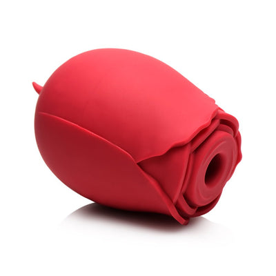 Palm-sized red silicone pleasure toy shaped like a rosebud with a textured opening for licking and suction stimulation.