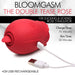 Red silicone rose-shaped stimulator with USB charging cable, highlighting 10x sucking and licking functions.