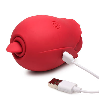 Red silicone Bloomgasm Double Tease Rose with USB charging cable connected, shown on white background.