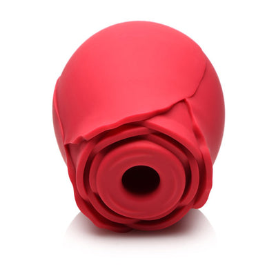 Red silicone pleasure toy shaped like a rose with a central suction and licking feature.