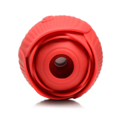 Close-up front view of a red silicone rose-shaped clit sucking stimulator with a central air-stim opening.