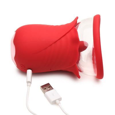 Red silicone flower-shaped personal massager with clear suction cup and USB charging cable on white background.