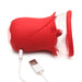 Red silicone flower-shaped personal massager with clear suction cup and USB charging cable on white background.