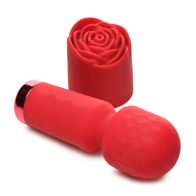 Compact red silicone wand vibrator with textured rose-shaped removable sleeve on white background.