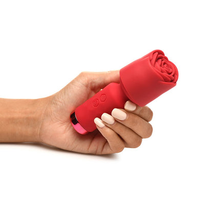 Hand holding a small red rose-shaped silicone vibrator with control buttons and a flexible neck.