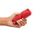 Hand holding a small red rose-shaped silicone vibrator with control buttons and a flexible neck.