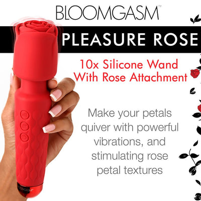 Hand holding a red silicone wand with a rose-shaped attachment and textured handle, featuring control buttons.