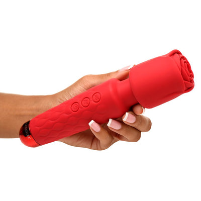 Hand holding a red Bloomgasm Pleasure Rose Wand with rose-shaped silicone attachment and textured handle.