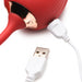 Close-up of red rose-shaped vibrator connected to a white USB charging cable on a white background.