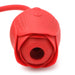 Close-up of a red silicone rose-shaped vibrator with a suction opening and control buttons on top.