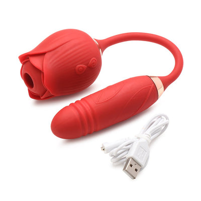 Red silicone rose-shaped vibrator with attached egg and USB charging cable on white background