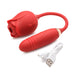 Red silicone rose-shaped vibrator with attached egg and USB charging cable on white background