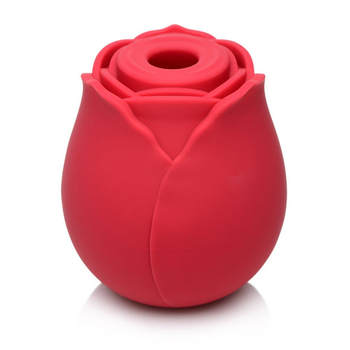Red silicone clit stimulator shaped like a blooming rose with a central suction opening.