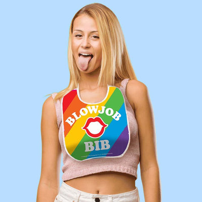 Woman wearing a colorful rainbow bib with "Blowjob Bib" text and lip graphic, posing playfully with tongue out against blue background.
