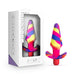 Colorful silicone vibrating plug with tapered head and flared base shown next to its white and purple Avant branded packaging.