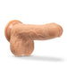 Realistic silicone dildo in vanilla color with suction cup base and detailed texture.
