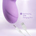 Close-up of purple Blush Evelyn vibrator showing power buttons and self-healing USB charging port with cable.