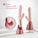 Blush Fraya Pink vibrator with dual stimulation, shown on stylish rose gold magnetic USB charging stand with USB-C cord.
