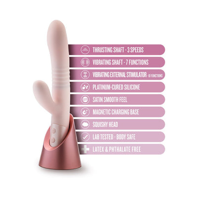 Blush Fraya Pink dual-stimulation vibrator with thrusting and vibrating shaft, external stimulator, and magnetic charging base.