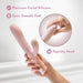 Hand holding a blush pink silicone dual-stimulation vibrator with squishy head and satin smooth finish.