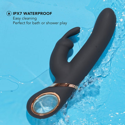 Black Blush Lush Victoria rabbit vibrator with waterproof design shown with water splashes on blue background.