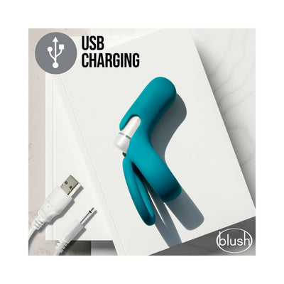 Teal silicone Noje C2 ring with USB rechargeable bullet vibrator displayed on white surface with charging cable.