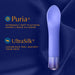 Purple vibrator on dark blue fabric background highlighting Puria silicone and UltraSilk luxurious texture features.