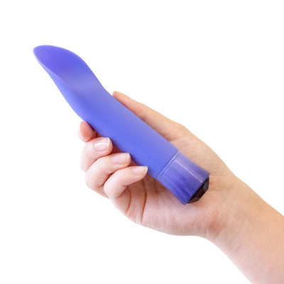 Hand holding a sleek purple curved vibrator with a smooth satin finish and faceted base.