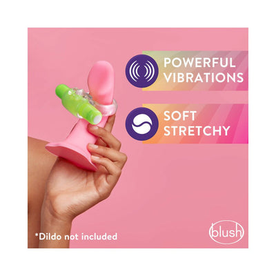Hand holding a clear vibrating C-ring with a green bullet vibrator on a pink silicone dildo, highlighting powerful vibrations and soft stretchiness.