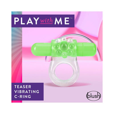 Clear vibrating c-ring with textured green bullet for enhanced sensation, displayed on pink and purple background.