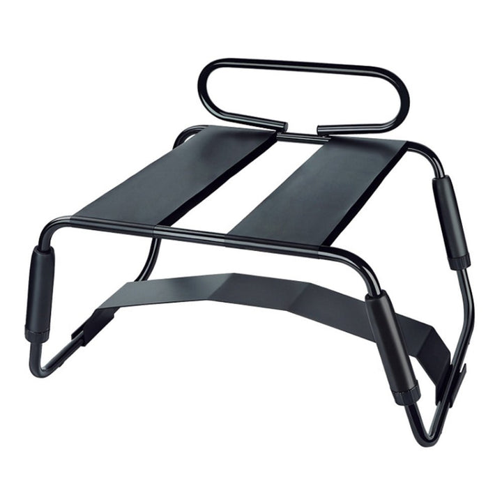 Black metal frame Temptasia Surrender Sex Chair with padded handles and adjustable elastic bands for support.