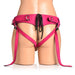 Back view of pink leather corset harness with adjustable straps and black lace-up detail on mannequin.