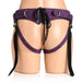 Back view of a purple leather corset harness with adjustable straps and black laces on a mannequin.