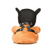 Back view of a light peach plush bear wearing a black puppy mask and faux leather harness with metal O-rings and studs.