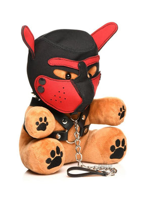 Light peach plush bear wearing a black and red puppy mask and faux leather harness with metal chain leash accessory.