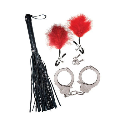 Bondage kit featuring black faux leather whip, metal handcuffs with keys, and red feather-adorned nipple clamps on white background.